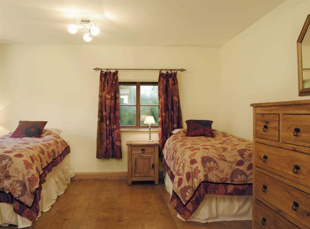 Twin bedroom at Masher’s Barn in Chapel Lawn, near Bucknell, Shropshire