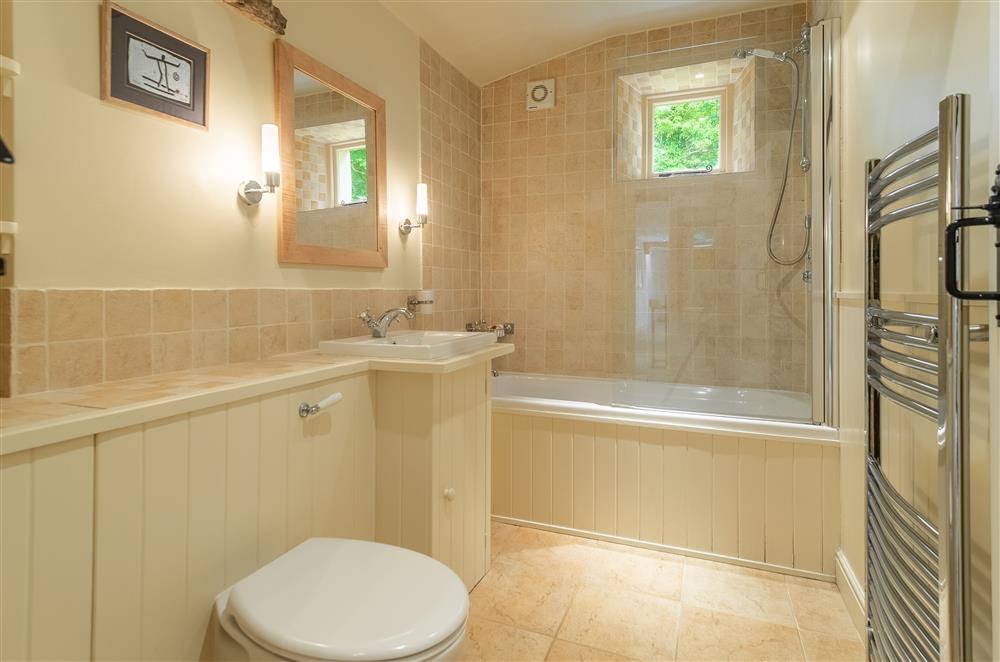 Family bathroom with bath  with overhead shower at Masongill Lodge, Masongill