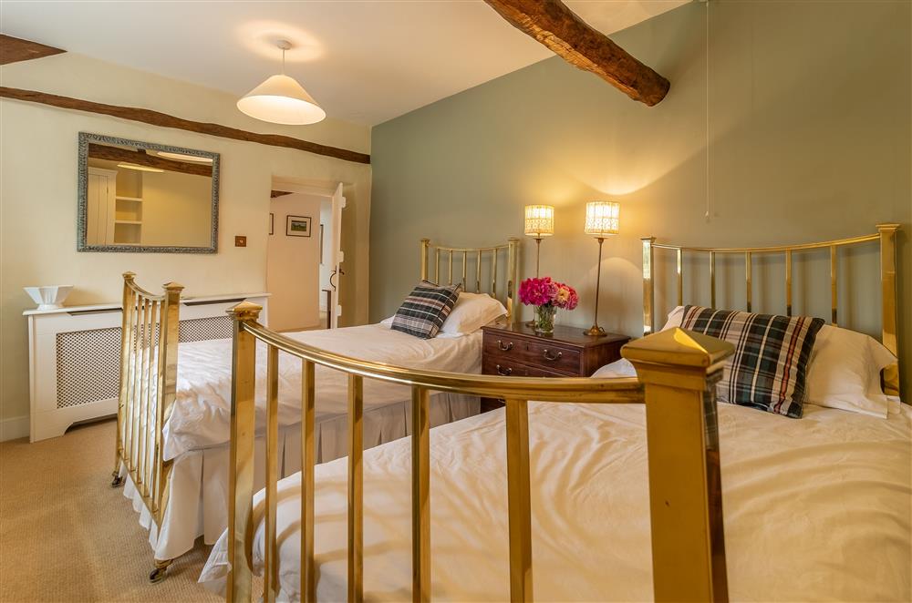 Twin bedroom with 3’ brass beds at Masongill Lodge, Masongill