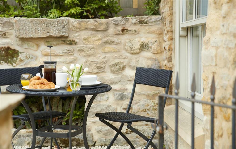 Small, enclosed outdoor seating area at Masons Cottage, Ampleforth