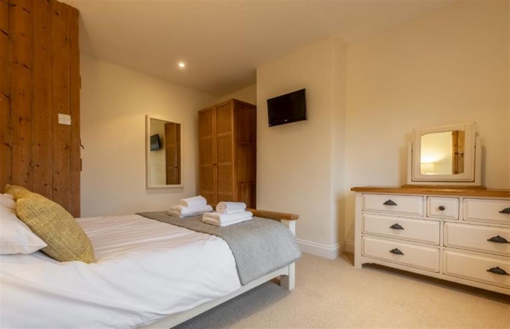 Bedroom two with wall-mounted television at Maurice Cottage, Docking near Kings Lynn