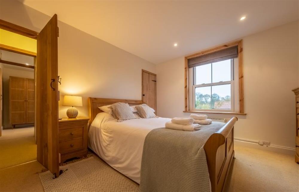 Master bedroom with 5’ king-size bed at Maurice Cottage, Docking near Kings Lynn