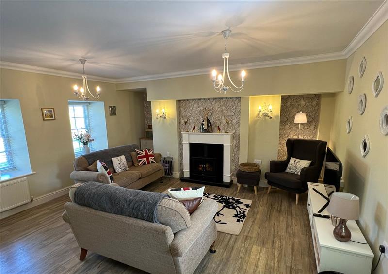 Relax in the living area at May Bell Cottage, Dersingham
