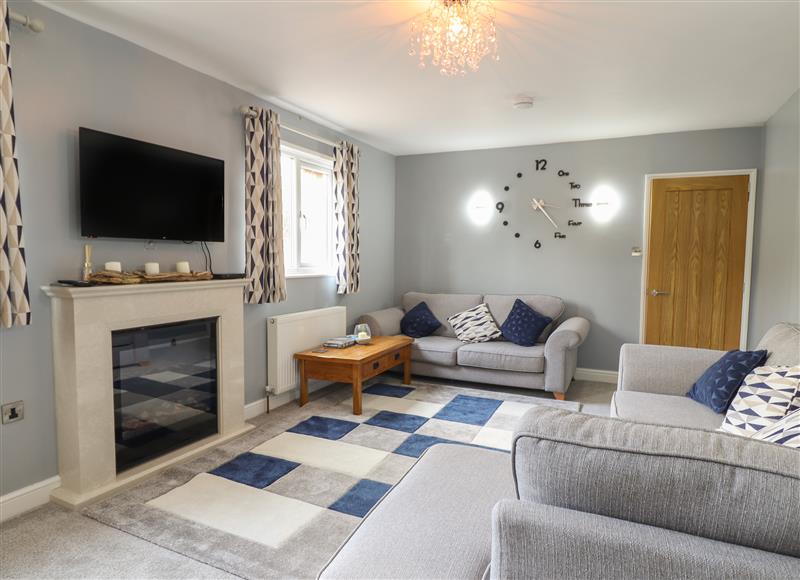 Relax in the living area at May Cottage, Llanfyllin