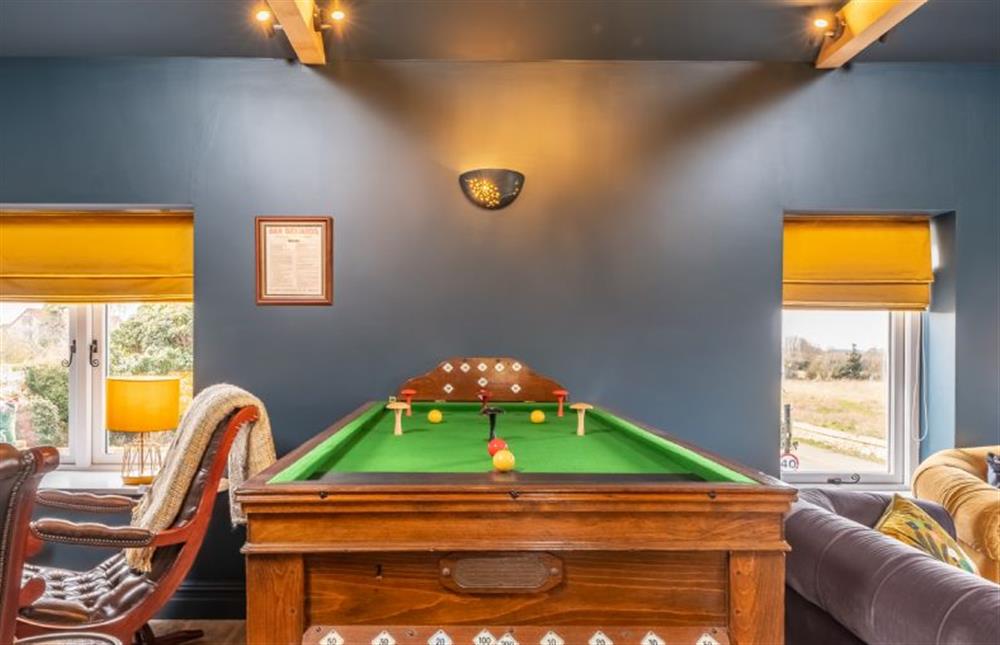 Enjoy a game on the bar billiards table at May Cottage, Titchwell