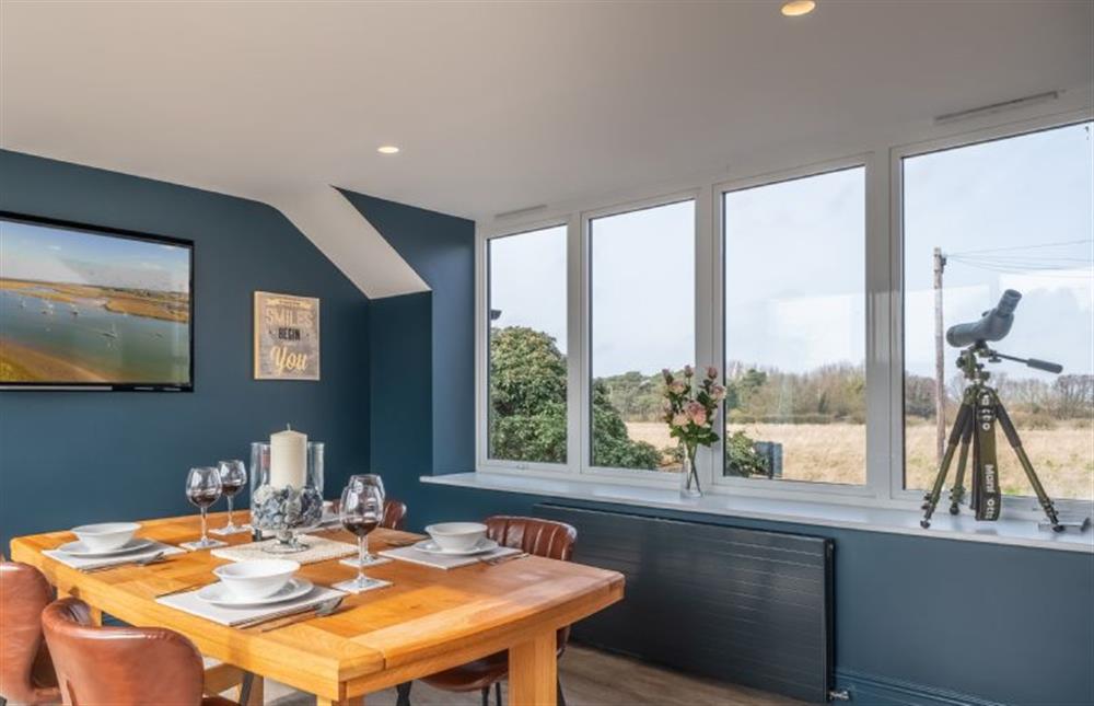 Take in the beautiful countryside views over a morning coffee  at May Cottage, Titchwell