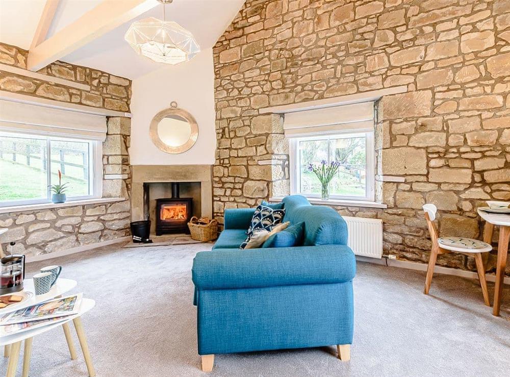 Living room/dining room at Maybeck Cottage in Ruswarp, near Whitby, North Yorkshire