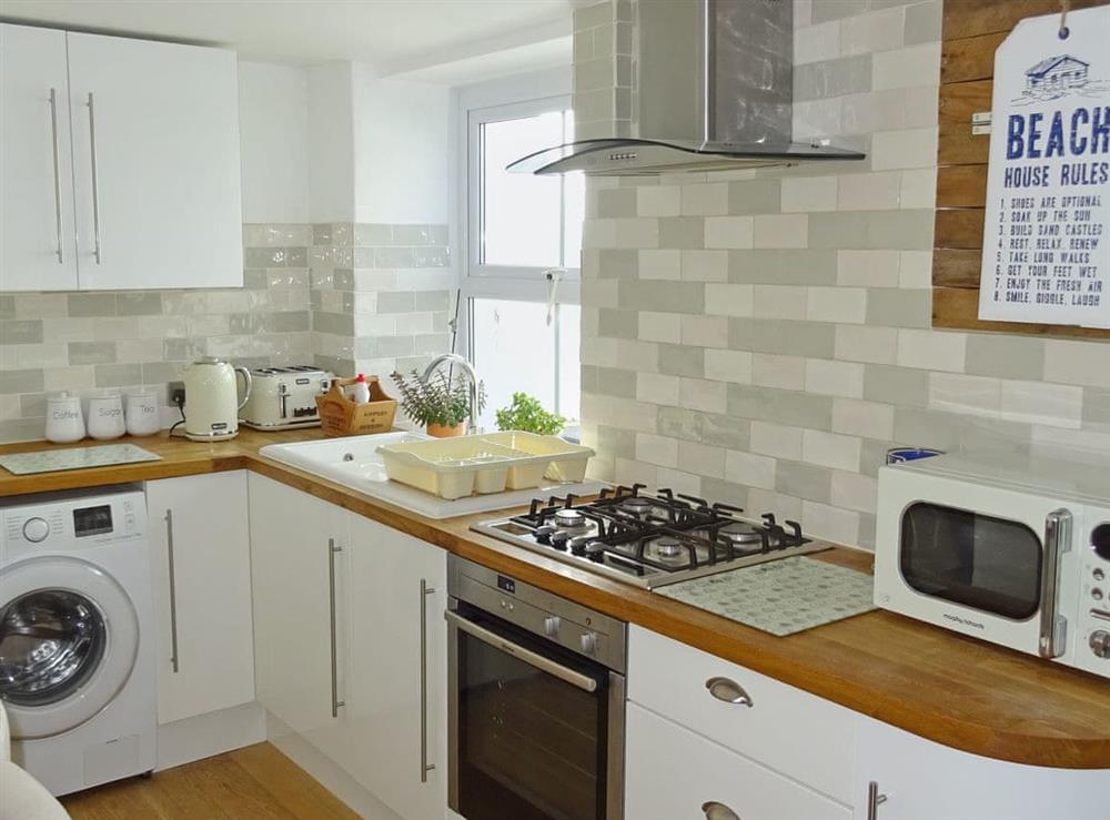 Light and airy kitchen with breakfast bar at Maybird Cottage in Hayle, Cornwall