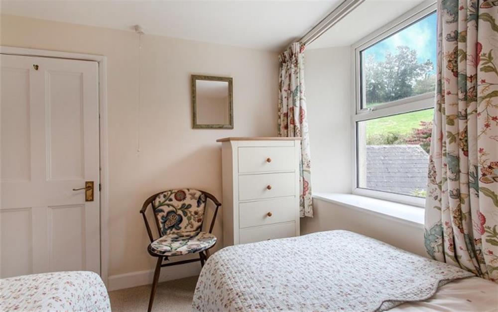 The twin bedroom with views over the garden and countryside to the rear of Maycombe. at Maycombe House in Beeson
