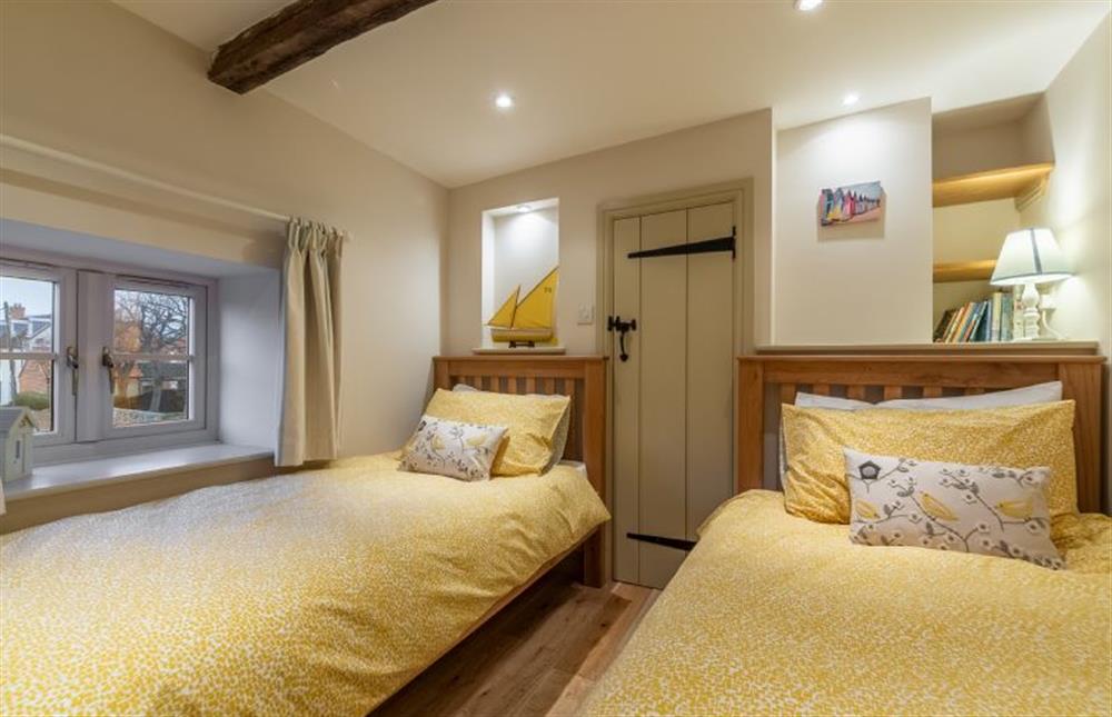First floor: Bedroom three has full-size single twin beds (photo 3) at Mayes Cottage, Brancaster near Kings Lynn
