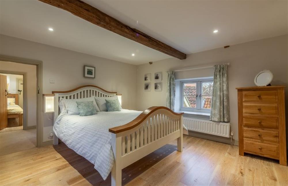 First floor: The Master bedroom has a king-size bed (photo 4) at Mayes Cottage, Brancaster near Kings Lynn