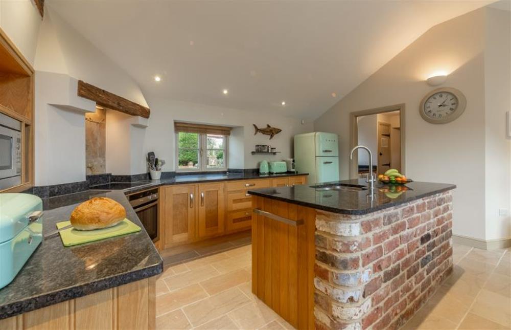 Ground floor: Kitchen has granite topped island (photo 2) at Mayes Cottage, Brancaster near Kings Lynn