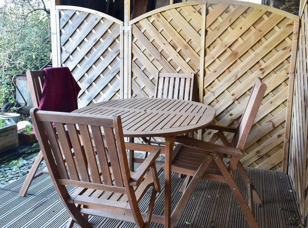Decked area with garden furniture at Meadow Bank Lodge in Staveley, near Kendal, Cumbria