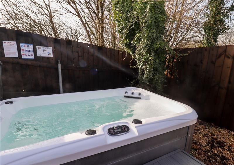 Relax in the hot tub at Meadow, Blandford Forum