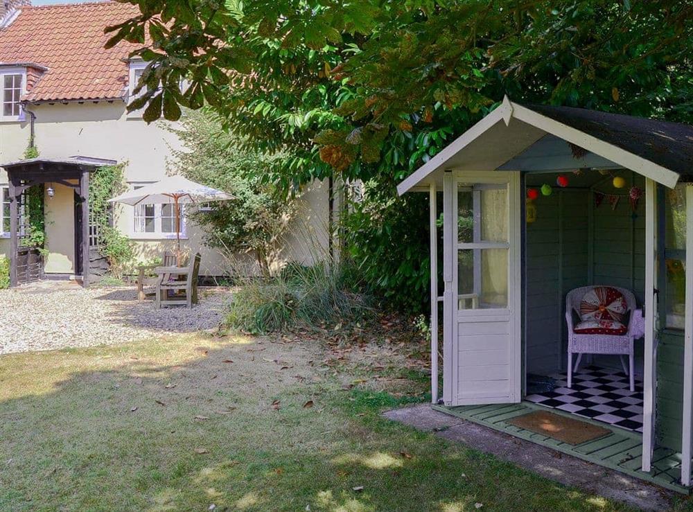 Charming summerhouse in the garden at Meadow Cottage in Irstead, near Wroxham, Norfolk