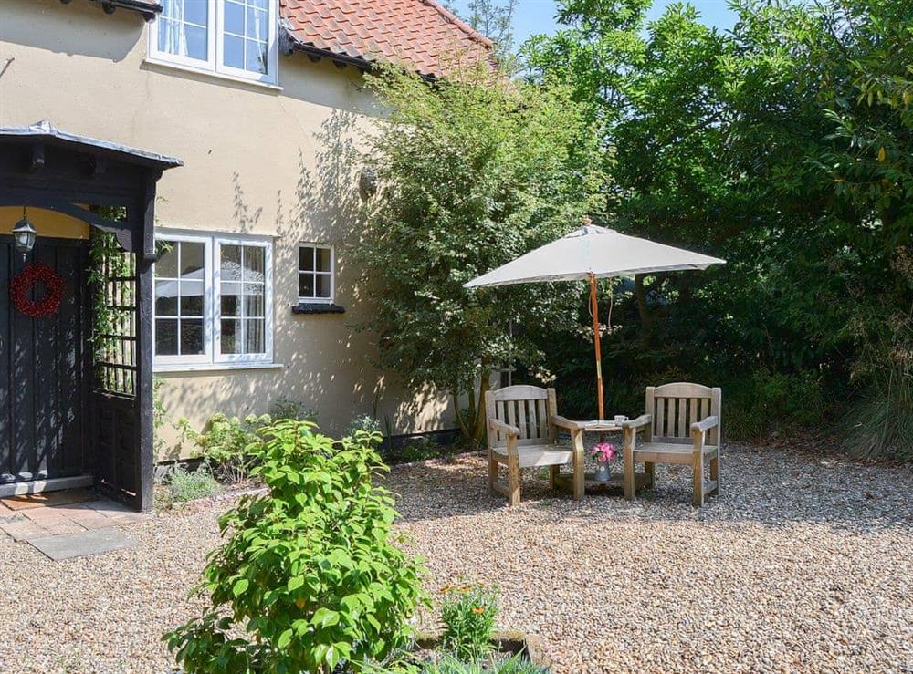 Delightful private shady sitting out area at Meadow Cottage in Irstead, near Wroxham, Norfolk