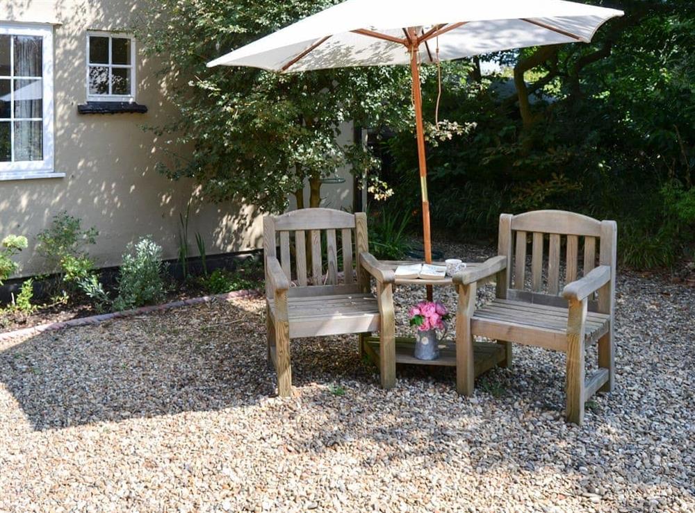 Lovely shaded sitting out area at Meadow Cottage in Irstead, near Wroxham, Norfolk