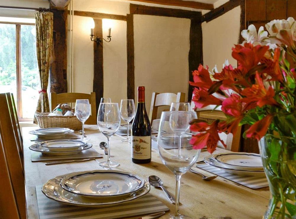 Charming dining room with exposed wooden beams at Meadow Cottage in Linstead Parva, near Southwold, Suffolk