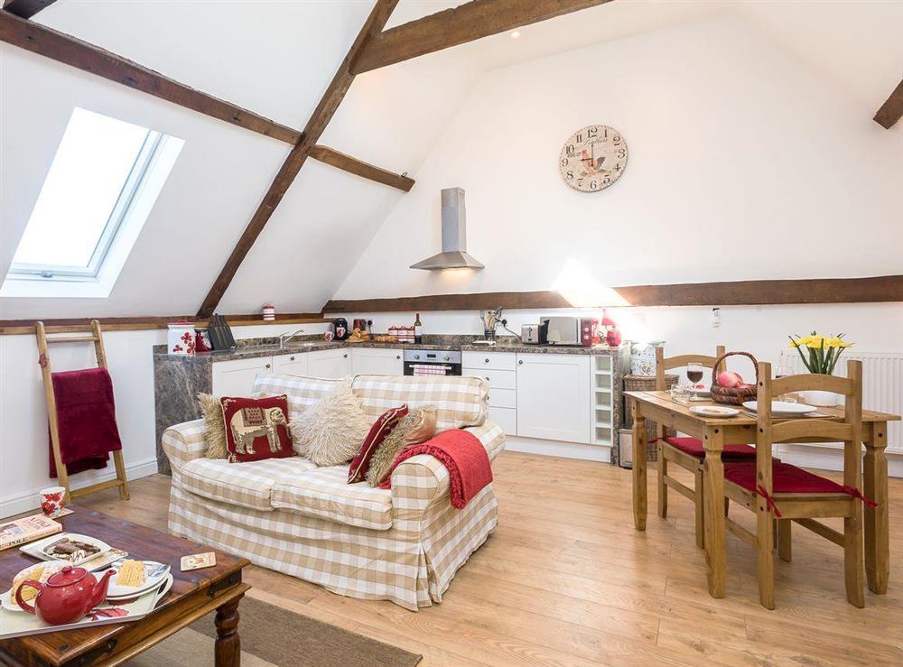 Charming open plan living space at The Cart Lodge, 