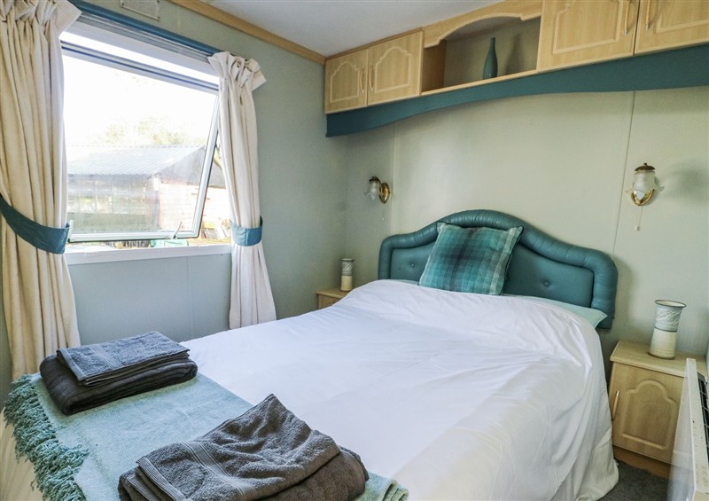 This is a bedroom at Meadow Island Caravan, Penygroes