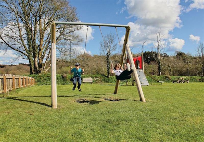 Children’s play area at Meadow Lakes Holiday Park in South Cornwall, South West of England