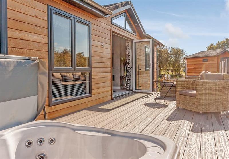 Decking and outdoor hot tub in The Aldeburgh at Meadow Lodges Woodbridge in Bredfield, Woodbridge