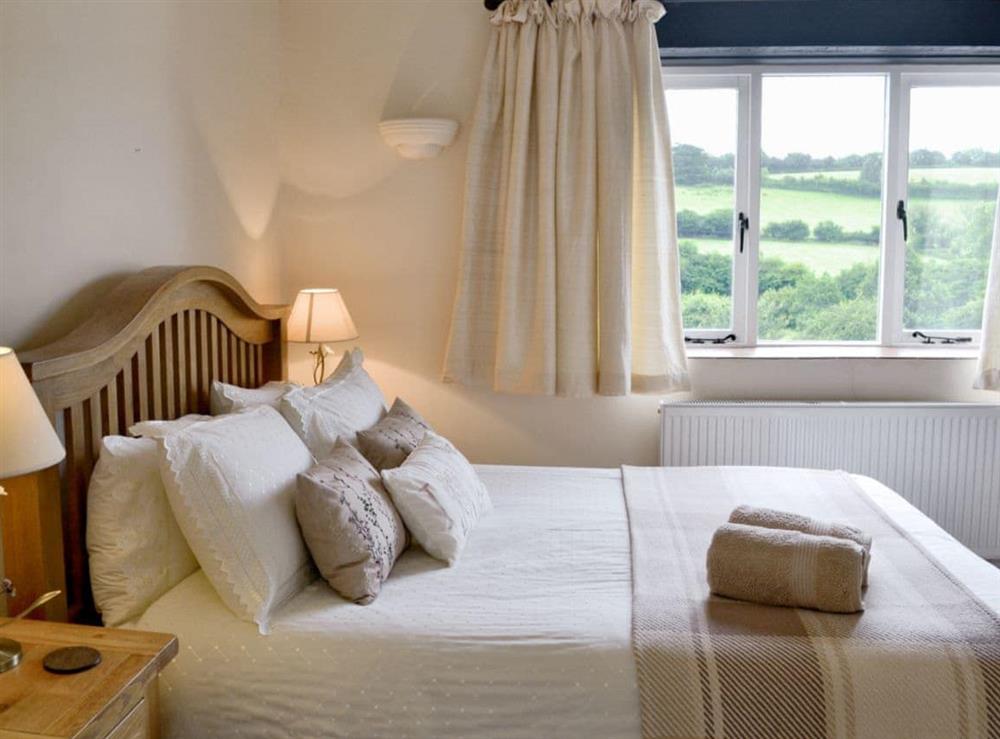Comfortable double bedroom with countryside views at Meadow Mews in Chillington, near Kingsbridge, Devon