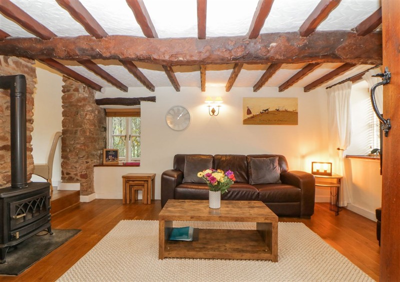 Relax in the living area at Meadow Thatch, Cockington