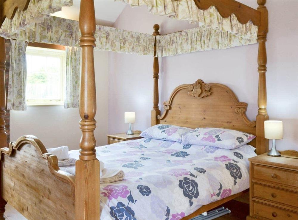 Comfortable four poster bedroom at Meadow View in Brandesburton, Nr Bridlington, East Yorkshire., North Humberside