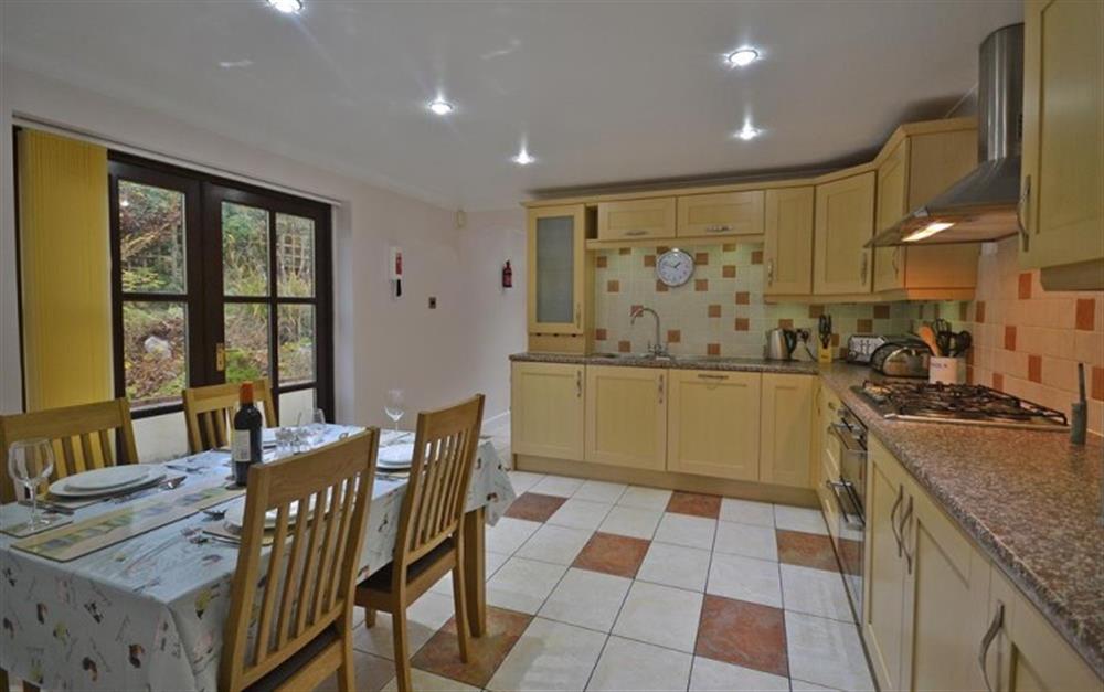 Kitchen with french windows to rear terrace & patio at Meadow View in Callington