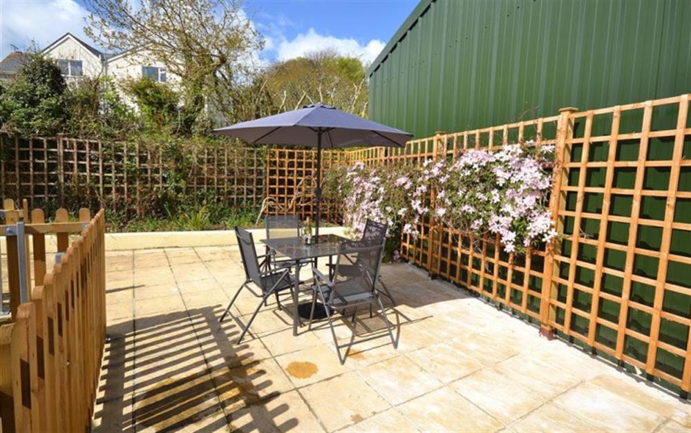 The sunny rear terraced patio. at Meadow View in Callington