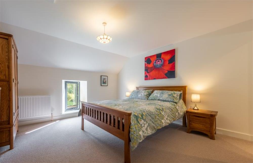 First floor: Master bedroom with 5ft king-size bed at Meadow View, Little Snoring near Fakenham