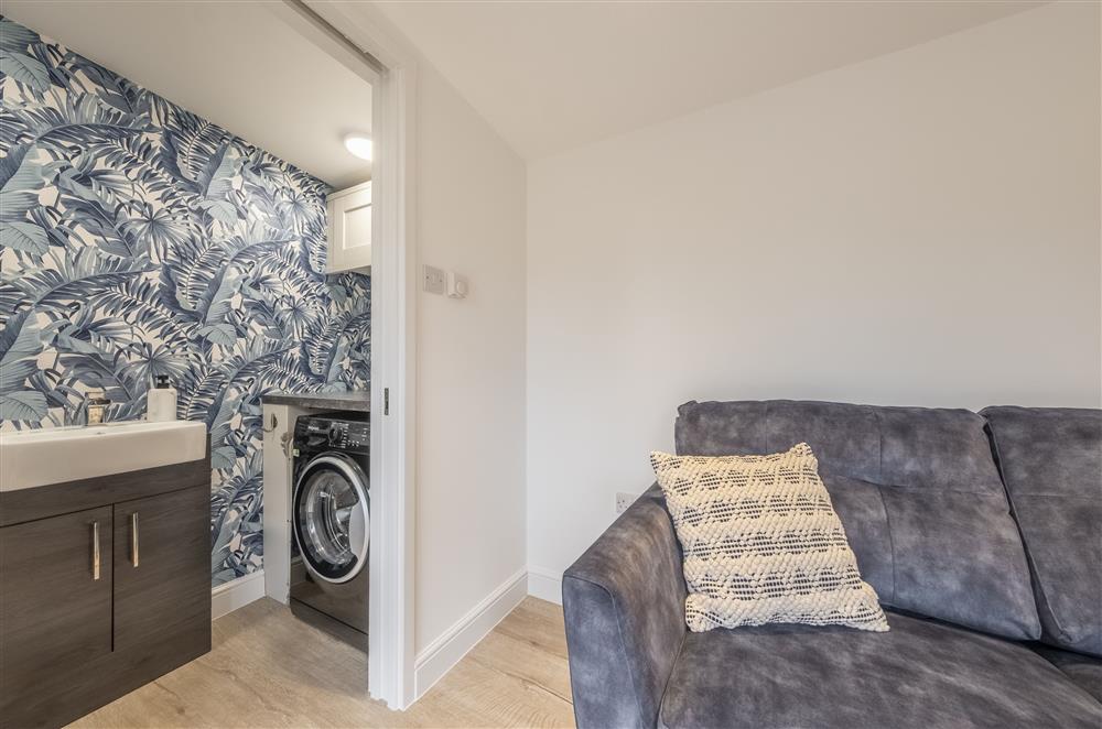 The garden room boasts a cloakroom, where you will also find the washing machine at Meadow View, near Buxton