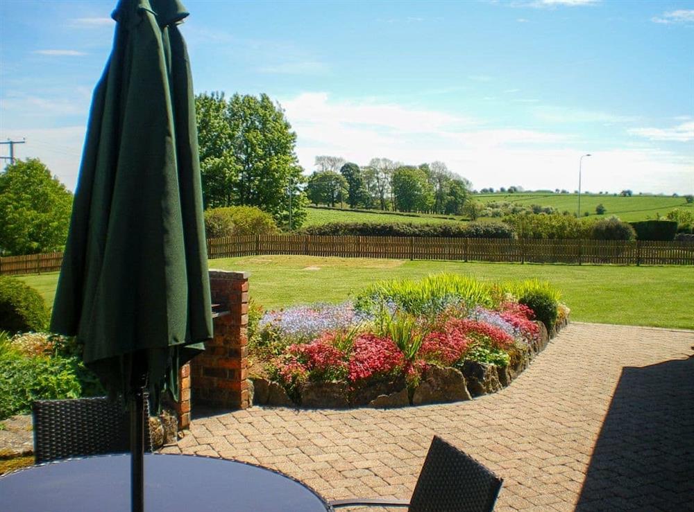 Spacious garden with patio and furniture at Meadowside Cottage in Calton Moor, Nr Ashbourne, Derbyshire., Great Britain