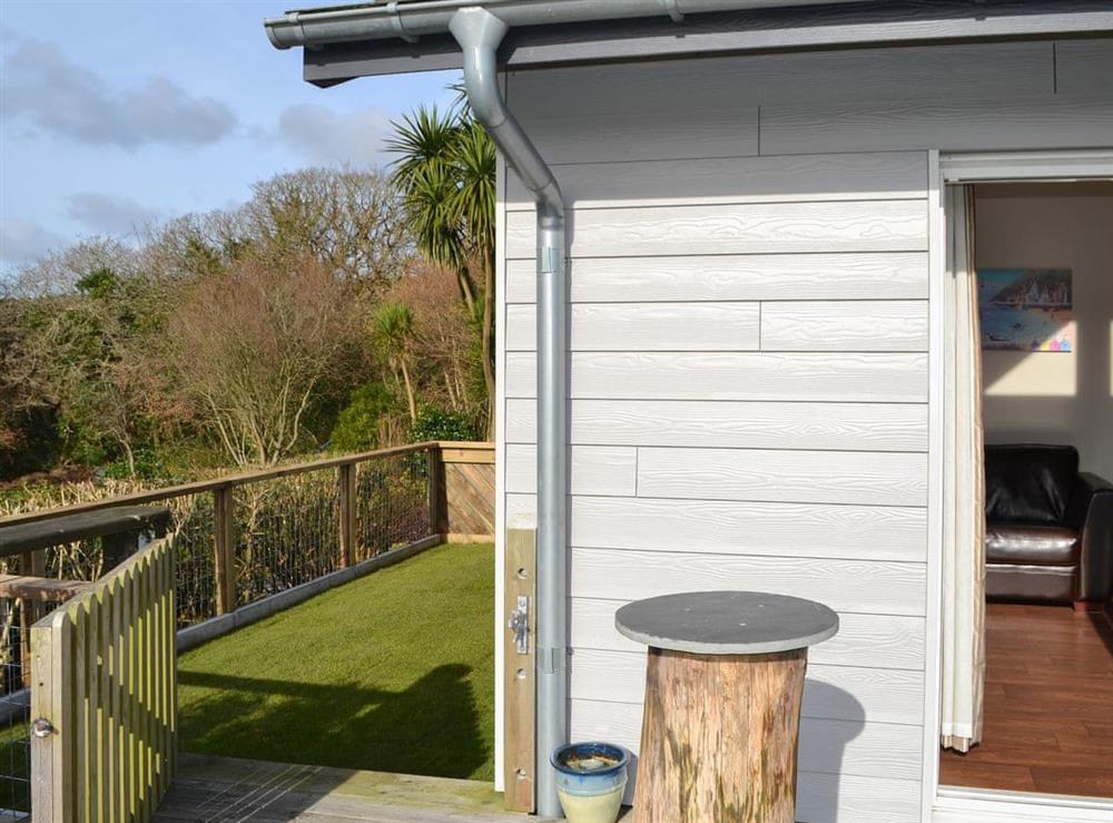 Decked area and side-garden at Meadowside in St Austell, Cornwall