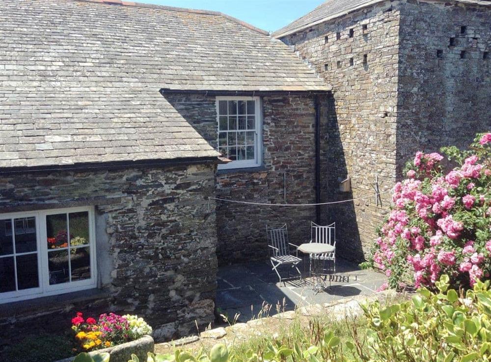 Enclosed rear courtyard with outdoor furniture at Meadwell in Trebarwith, Delabole., Cornwall