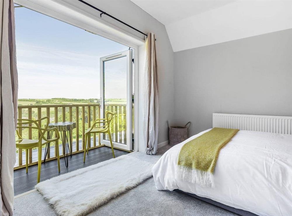 1st floor master bedroom with balcony at Meeresblick in St Just in Roseland, Cornwall