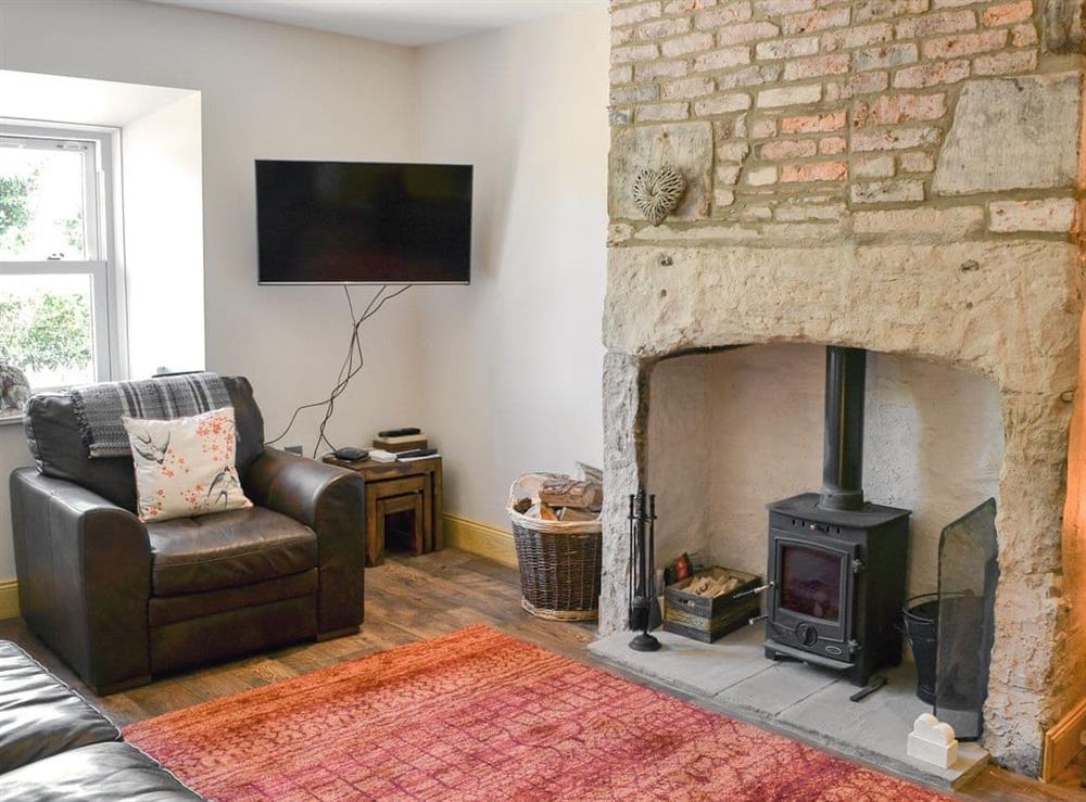 Charming living room with wood burner at Melandra in Belford, near Alnwick, Northumberland