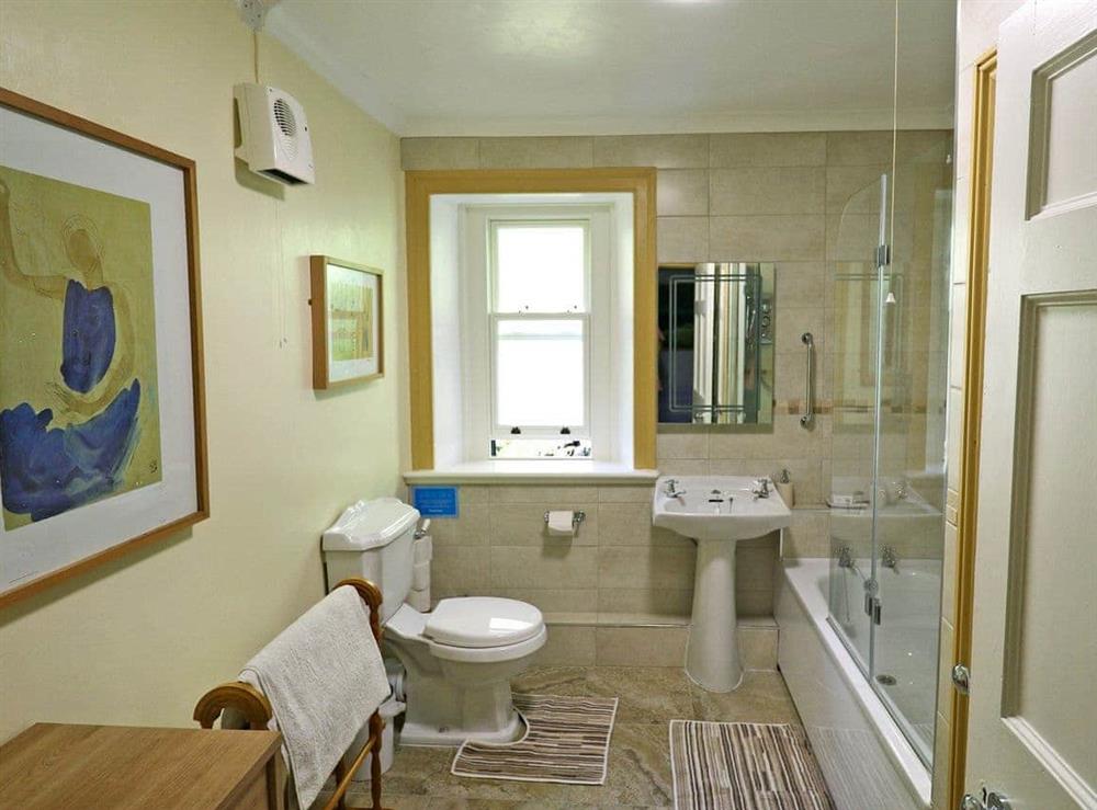 Large bathroom with shower over the bath at Melindwr in Hen Goginan, near Aberystwyth, Dyfed