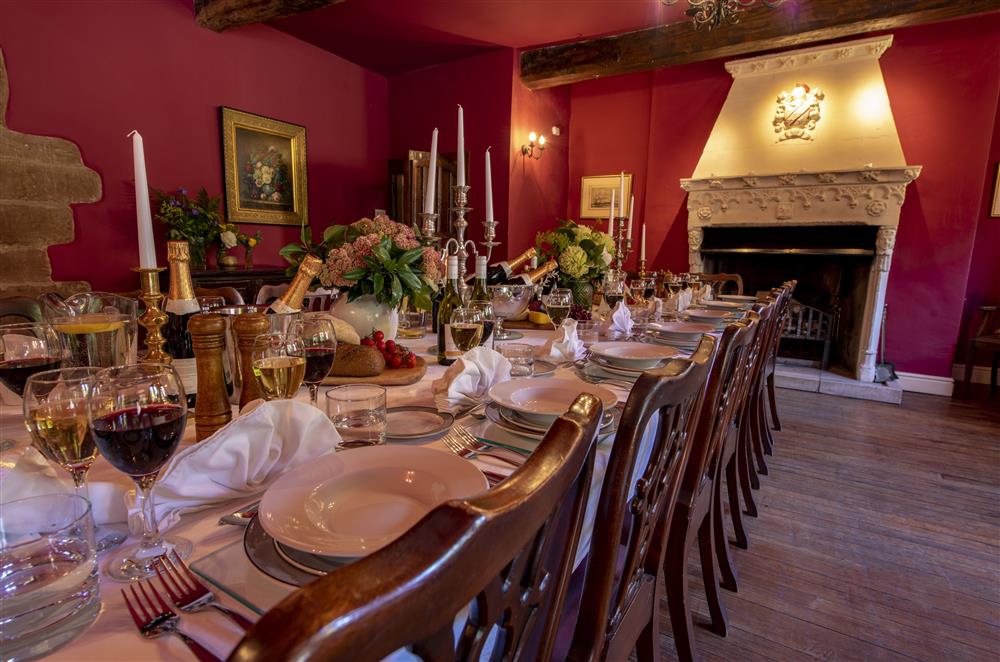 Enjoy gathering in the dining room by the open fire which was salvaged from one of the local castles at Melmerby Hall and Stag Cottage, Melmerby, near Langwathby, Penrith