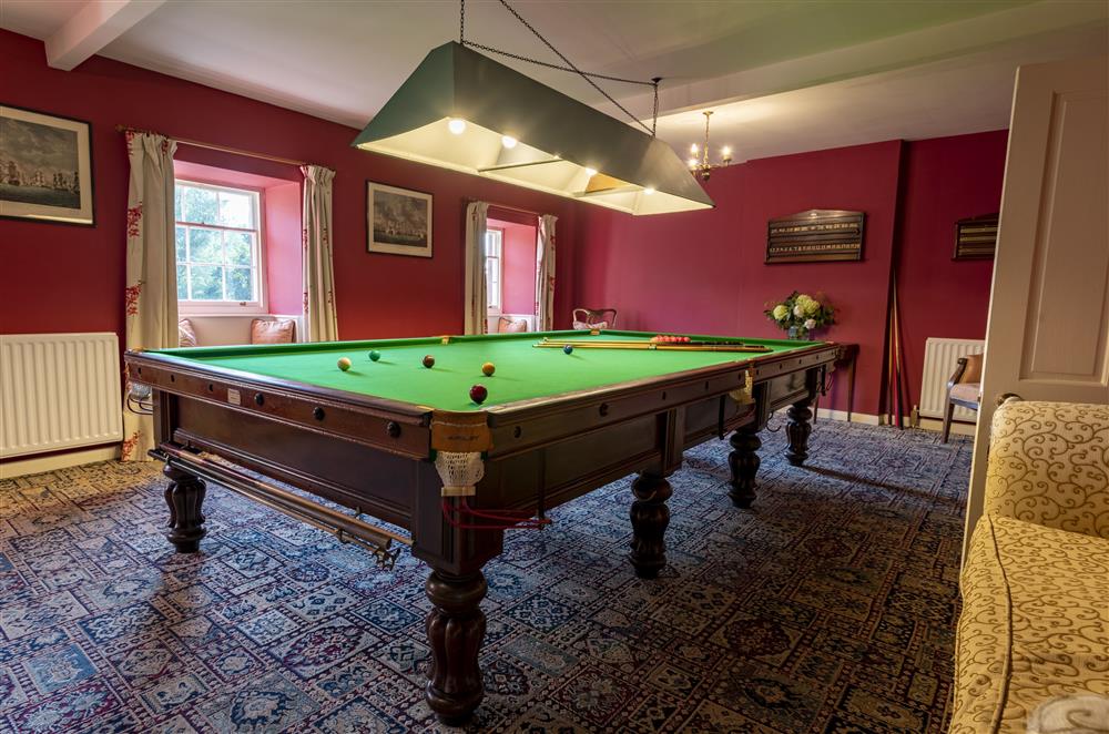 The billiards room on the second floor has a full-size table and an open fire at Melmerby Hall and Stag Cottage, Melmerby, near Langwathby, Penrith