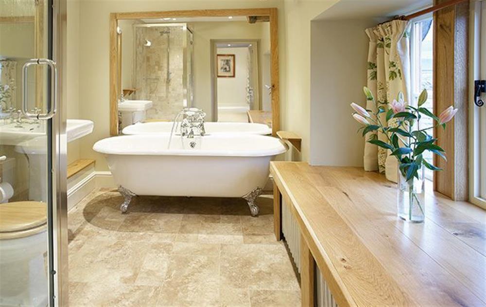 The Nursery en-suite bathroom with separate bath and shower at Melmerby Hall, Melmerby