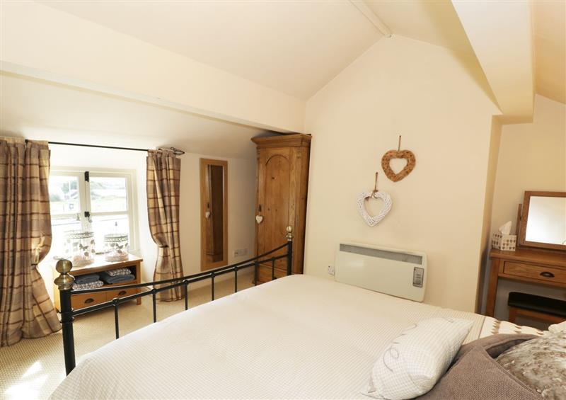 This is a bedroom (photo 2) at Menai Cottage, Brynsiencyn