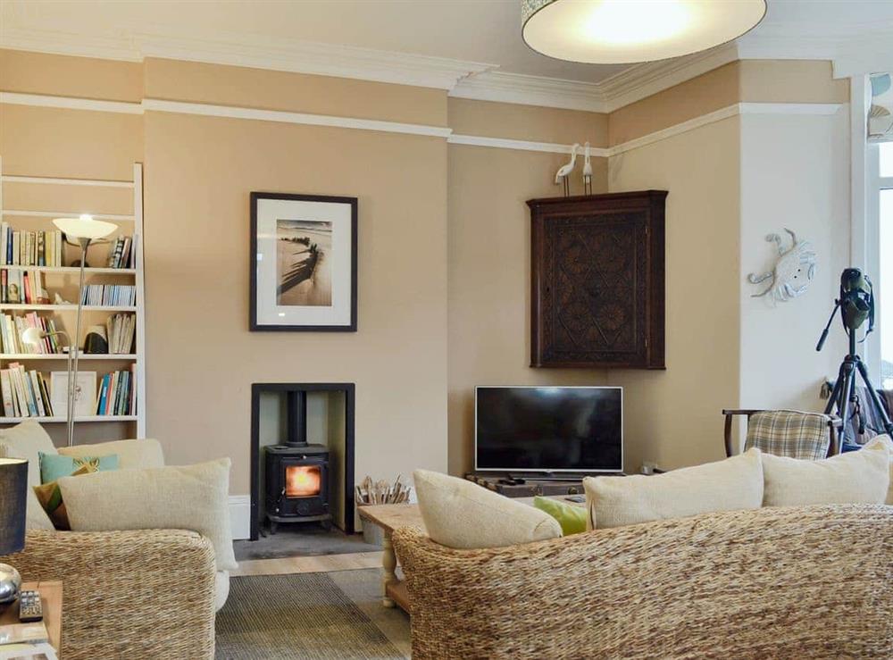 Delightful living room with wood burner at Neuadd, 