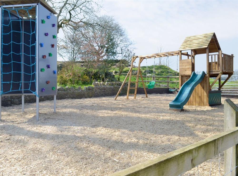 Enclosed children’s play zone at Mendip in Priddy, near Wells, Somerset