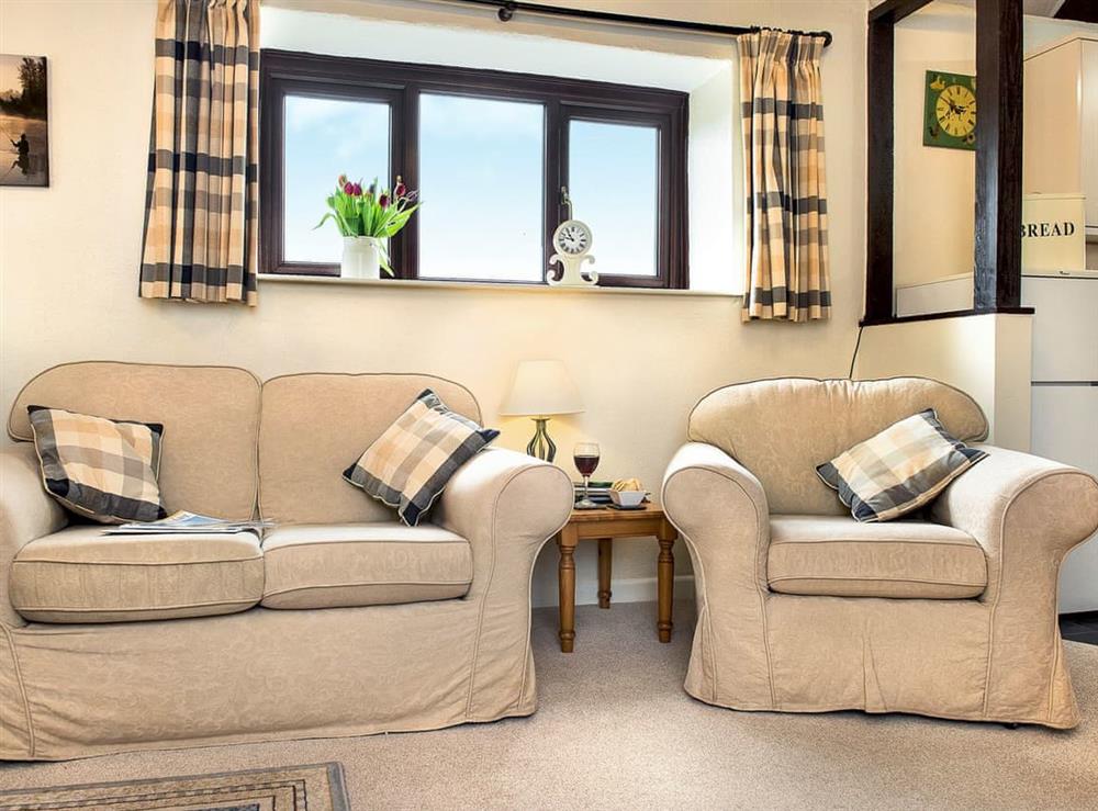 Cosy furniture in living area at The Byre, 