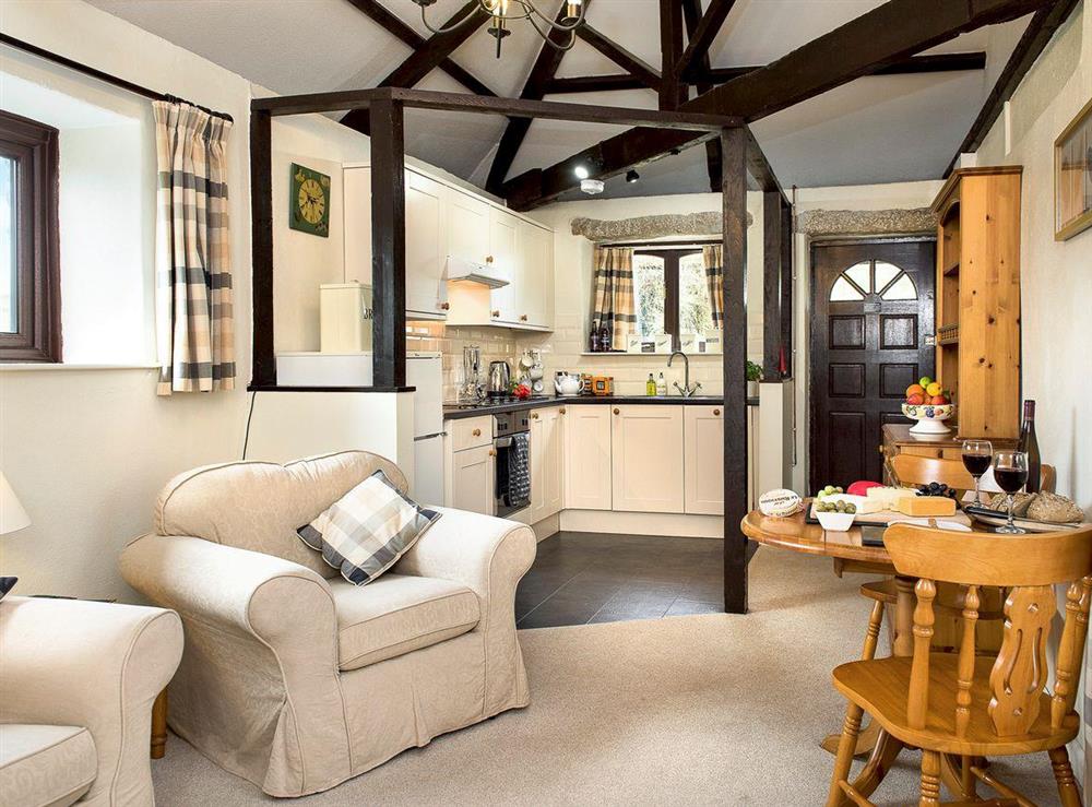 Exposed wood beams throughout the open-plan living space at The Byre, 