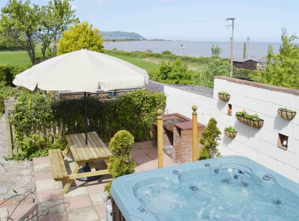 Garden, BBQ area and hot tub at Applegarth, 