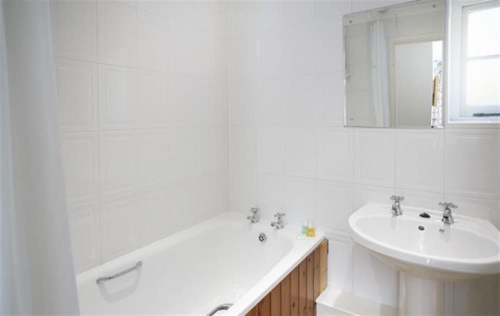Bathroom with shower over bath at Mews Cottage, Helston