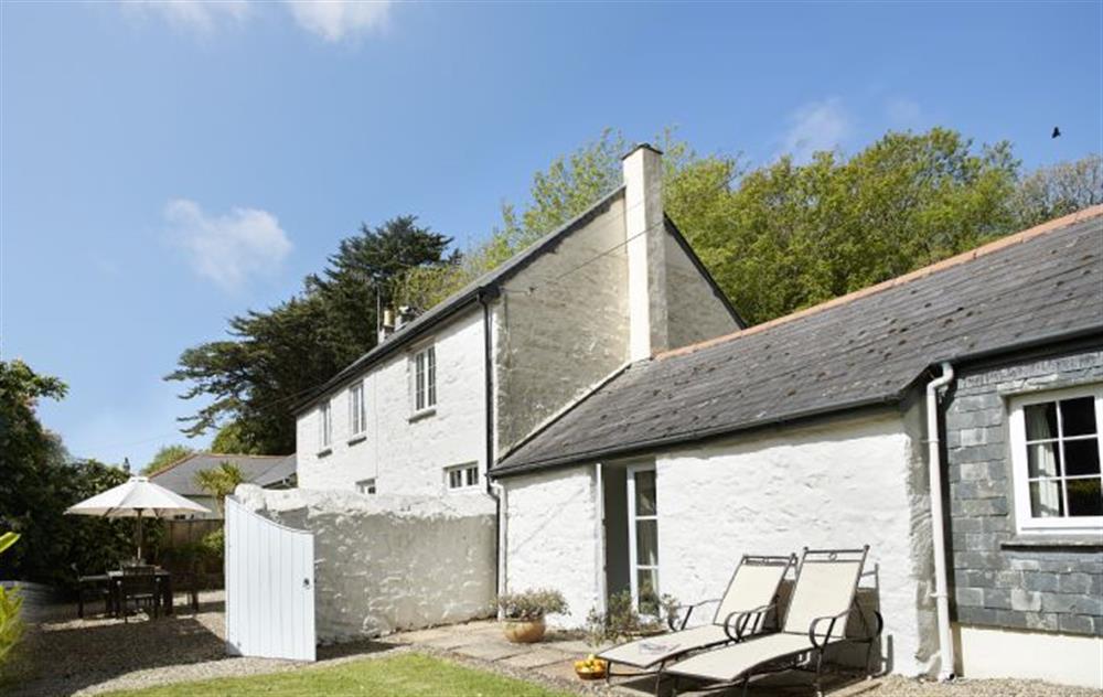 Private gravel and lawn courtyard to the front at Mews Cottage, Helston